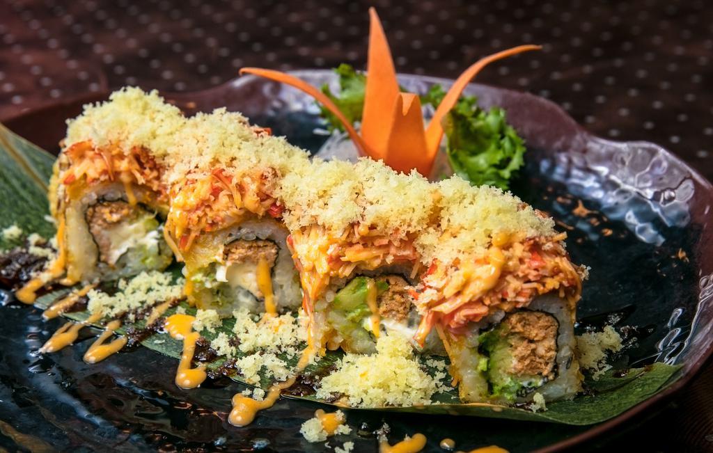 Golden Dawn · Inside; spicy tuna, cream cheese, avocado roll tempura fried. Out ;spicy kani ,eel sauce scallop., spicy mayon.