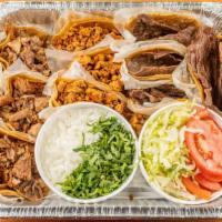 Comales Taco Tray · Twenty tacos with your choice of meats & a pitcher of horchata or soda. All tacos come plain...