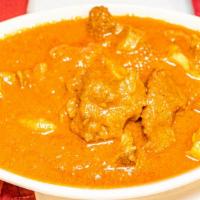 Lamb Or Goat Curry · Delicious traditional curry served with tender pieces of lamb or goat cooked with herbs and ...