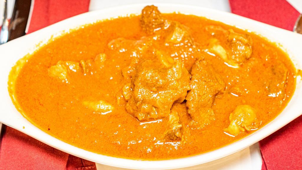 Lamb Or Goat Curry · Delicious traditional curry served with tender pieces of lamb or goat cooked with herbs and spices.
