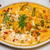 Vegetarian Korma · Mix veg cooked with onion, tomato, creamy sauce and blend with touch of yogurt.