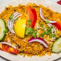 Chicken Biryani · Delicious basmati rice cooked with boneless chicken, yogurt, spices, herbs and flavor of saf...