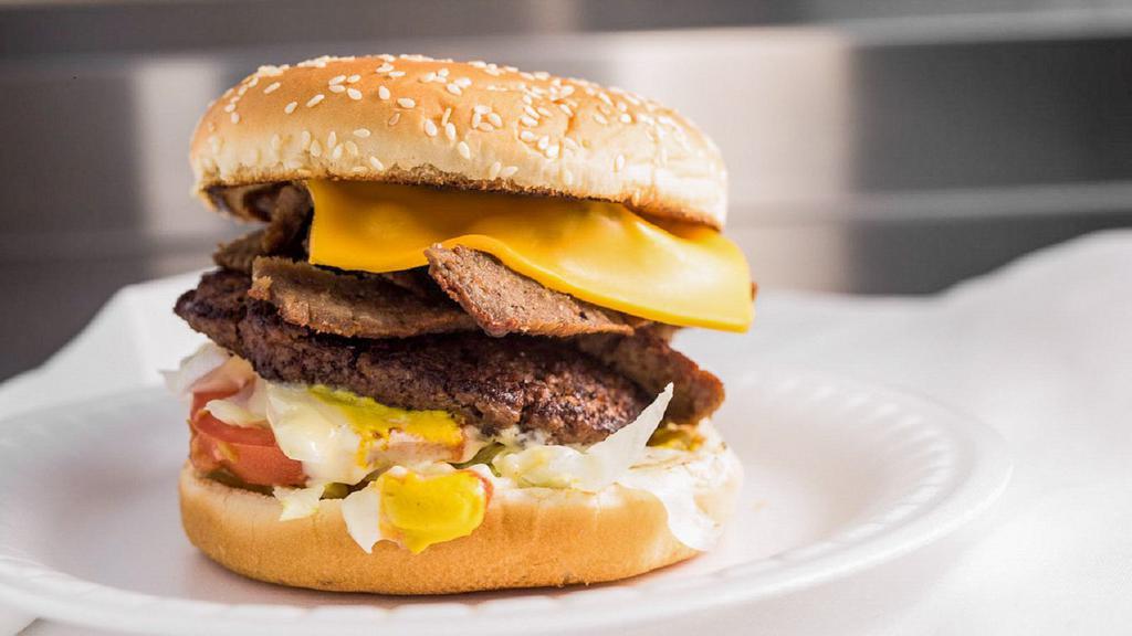 Gyro Burger · Fresh burger patty topped American cheese, lettuce, tomatoes, onions, ketchup, mustard, mayo, and pickles.