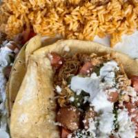 Street Tacos · Two semi-crisp corn tortillas with choice of chicken, beef, or pulled pork, topped with home...