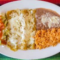 Enchilada Dinner · Three corn tortilla enchiladas filled with your choice of meat, topped with your choice of s...