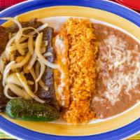 Tampiquena · Grill tender skirt steak garnish with grill onions and accompanied by one red cheese enchila...