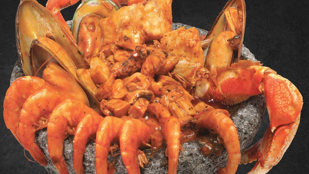 Molcajete De Mariscos · Crab legs, mussels, langostinos, scallops, shrimp, octopus, and surimi sautéed in a spicy sauce.