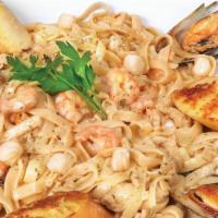 Pasta Marinera · Fettucine with shrimp, octopus, mussels in a cream sauce.