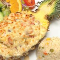Piña Rellena · Pineapple stuffed with shrimp, octopus, surimi, bell peppers, diced pineapple and cheese. Se...
