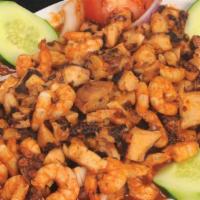 Chapuzón Chico · Shrimp, octopus and oysters sautéed in our spicy house seasoning.
