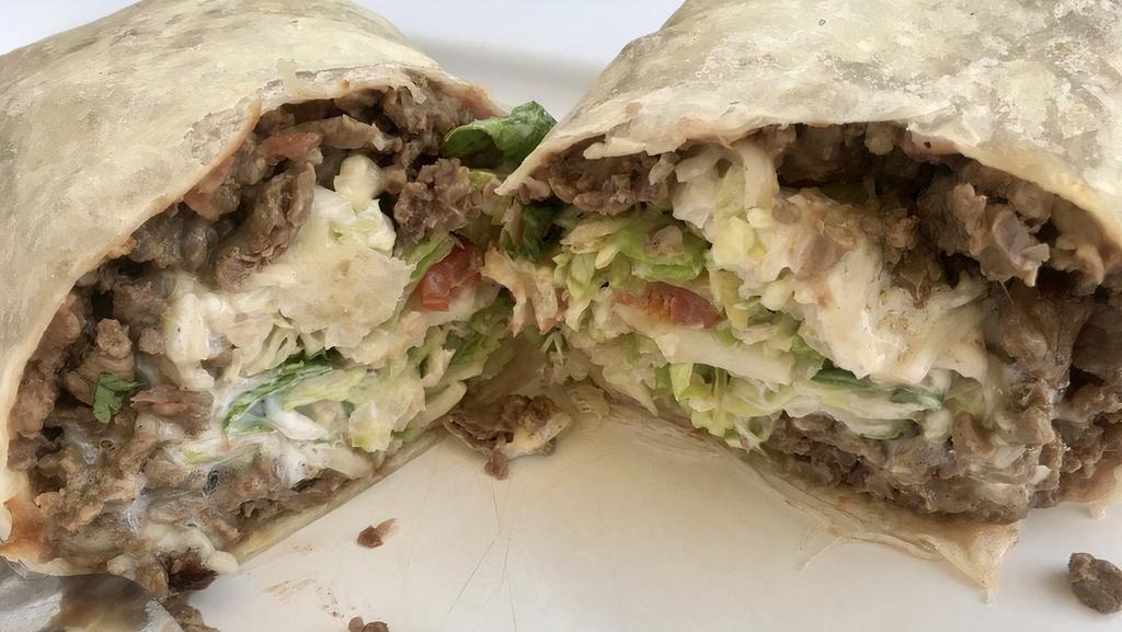 Burrito · Your choice of meat, beans, lettuce, tomato, cheese, and sour cream wrapped in a flour tortilla.