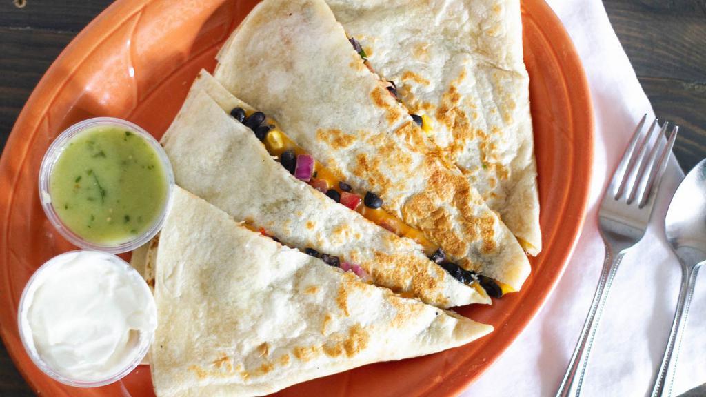 Meat Quesadilla · Flour tortilla filled with cheese and your choice of meat served with pico de gallo, lettuce, guacamole, and sour cream.