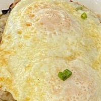 Biscuits And Gravy Skillet · Savory sausage, onions, peppers, sausage gravy, and eggs, all on top of your choice of potato.