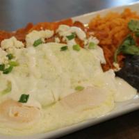 Chilaquiles · Corn tortillas, house-made red salsa, three eggs any style, queso fresco Mexican cheese, sou...