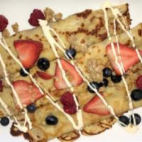 Granola Berry Crepes · French-style crepes filled with sweetened cream cheese, fresh strawberries, and blueberries,...