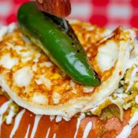Torta De Chilaquiles · Mexican sandwich served on a bread roll.