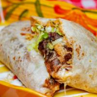 Burrito - Steak · Wrapped flour tortilla filled with cheese, refried beans, rice, steak, lettuce, tomato, and ...
