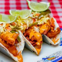 Fish Tacos · $5.75 each - Soft flour tortillas filled with crispy fried fish, chipotle mayo and topped wi...