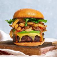 Freaky Fries Day Burger · American beef patty topped with fries, avocado, caramelized onions, ketchup, lettuce, tomato...