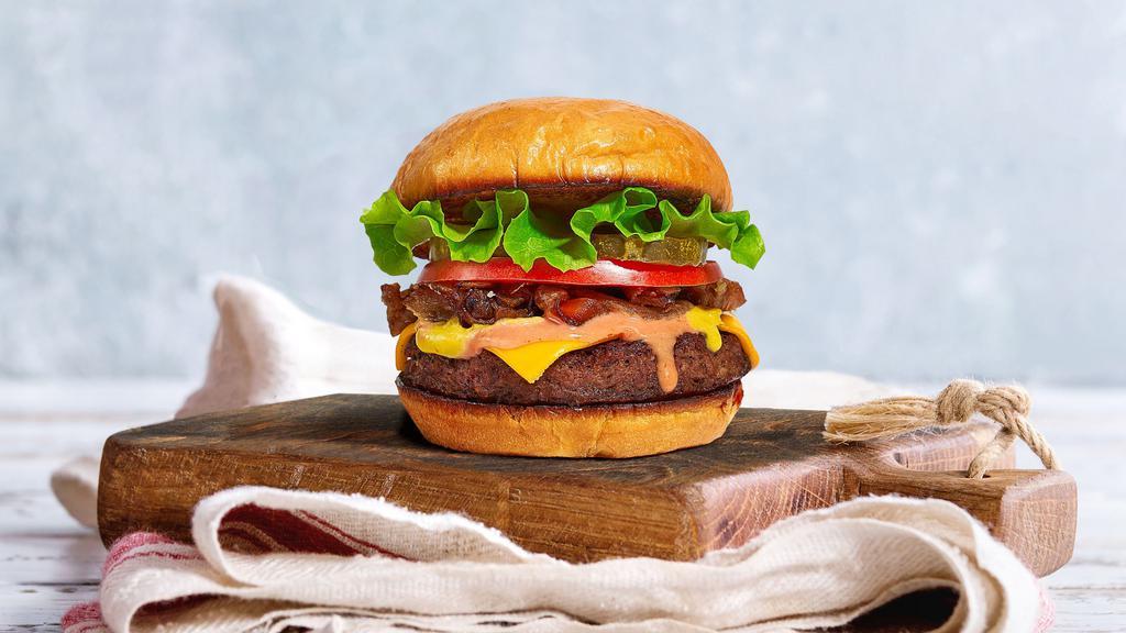 Just The Classic Burger · American beef patty topped with lettuce, tomato, onion, and pickles. Served on a warm bun.