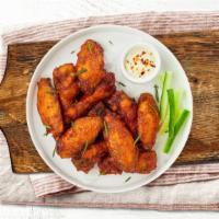 Winged Cluck · Fresh chicken wings fried until golden brown.