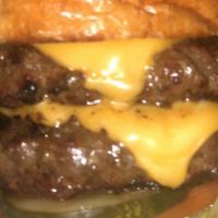 Double Cheeseburger · Brioche bun with 2 flames grill burgers, topped with American cheese, lettuce, tomato, pickl...