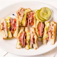 Classic Club Supreme · Ham, turkey, bacon, lettuce, tomato, Swiss and American cheese on grilled bread.
