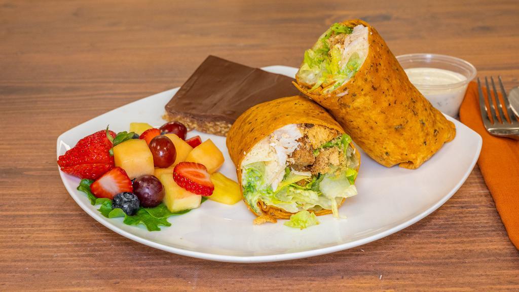 Chicken Caesar Wrap · Roasted chicken breast, romaine lettuce, shaved Parmesan cheese, homemade croutons, and our royal Caesar dressing.