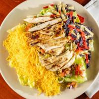 Southwest Chicken Salad · A mix of fresh greens, tortilla strips, pico de gallo, mixed cheese, seasoned chicken breast...