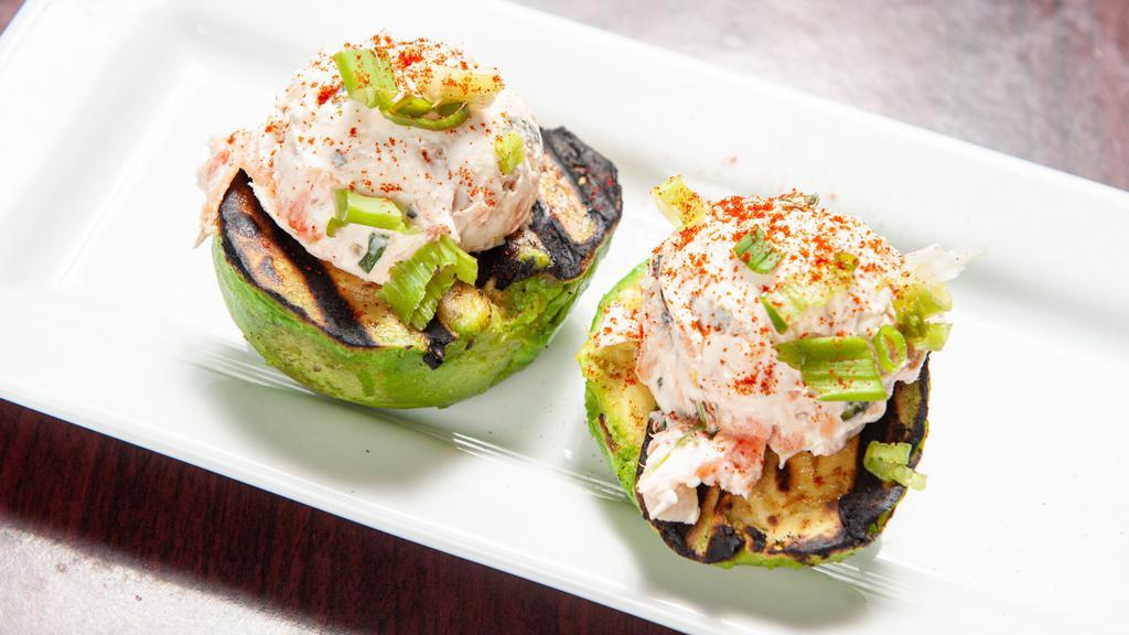 Grilled Avocado · Two grilled avocado halves stuffed with cream cheese, pico de gallo, and Norwegian smoked trout.