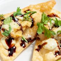 Oysters · Cornmeal fried oysters served on a crispy wonton with habanero aioli and a balsamic reduction.