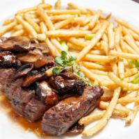 Steak Frites Au Poivre · Peppercorn crusted creekstone farms flank steak, pan seared and sliced. Served with a wild m...