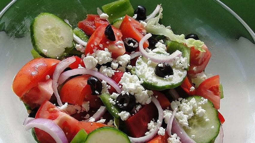 Greek Salad · Feta cheese, olives, lettuce, tomato, cucumbers, onion.