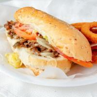 Philly Steak · Steak mounded with Provolone cheese, grilled onion, mushrooms, tomatoes and mayo.