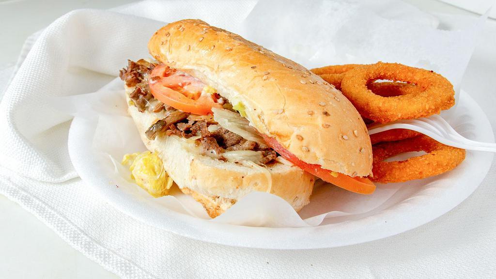 Philly Steak · Steak mounded with Provolone cheese, grilled onion, mushrooms, tomatoes and mayo.