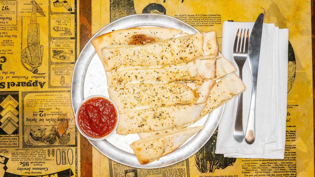 Italian Fries With Cheese · Our flaky thin pizza crust folded in half and filled with mozzarella cheese, topped with garlic butter and our special spices. Served with dipping sauce. Extra pizza toppings additional charge. Maximum of two.