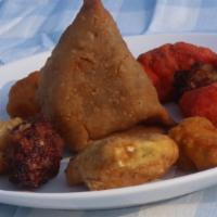 Shahi Combination · Combination of vegetable samosa, pickle pakora, vegetable pakora, chicken pakora and fish pa...