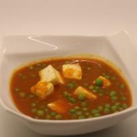 Mater Paneer · Homemade cheese and green peas cooked in mildly spiced gravy.