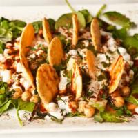 Chaat · A mouthwatering combination of boiled chickpeas, chopped fresh onions, plain yogurt, chaat m...