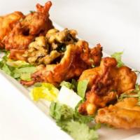 Pakora · Gluten-free. Lightly battered delicacies fried in all-natural canola oil.