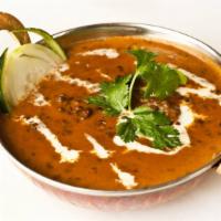 Dal Makhani · Gluten-free. Whole black lentils simmered until tender, then sautéed with garlic, ginger, ol...