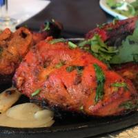 Tandoori Chicken · Gluten-free.  Spring chicken marinated overnight in traditional herbs and spices, and a crea...