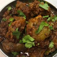 Bhuna Chicken Masala (Hot) · Gluten-free. Tender pieces of fresh boneless chicken cooked with fresh onions, tomato, ginge...
