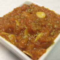 Carrot Halwa (Signature) · Homemade carrot pudding cooked with milk, cashew and almonds, served hot.