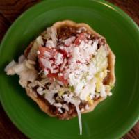 Sope Ala · Taste the authentic Mexican snack characterized by its distinctive pinched up rim which hold...