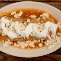 Enchilada Ala · A rolled up corn tortilla filled with your choice of shredded chicken, ground beef or cheese...