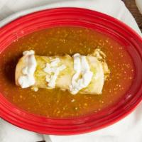 Enchilada Suiza Ala · A rolled up corn tortilla filled with chicken, topped with melted Chihuahua cheese, green to...