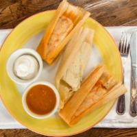Tamales · Three homemade tamales served in their corn husks. Filled with either chicken in a green tom...