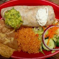 Burrito Dinner · Filled with beans, lettuce, tomato, cheese, and your choice of: ground beef, pulled chicken,...