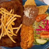 Milanesa De Res · Breaded round steak, pan fried and topped with French fries. Served with Spanish rice, refri...
